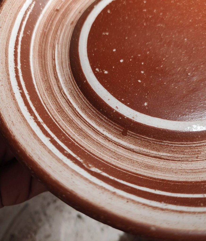 Red clay dessert plate with white band